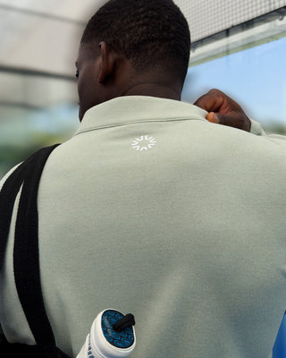 VALLEA Half Zip in Jade, half length front zip on a pale green mid layer